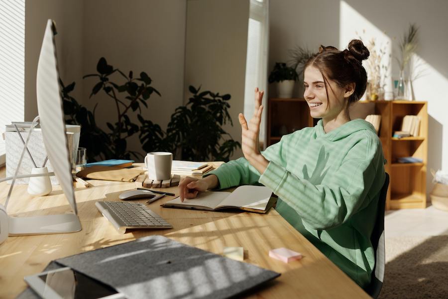 Woman on a video call in her home office.